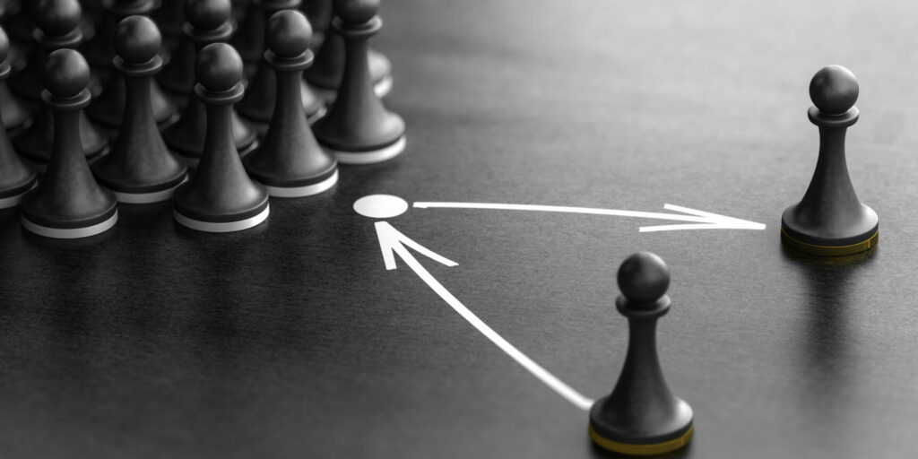 3d,Illustration,Of,Pawns,Over,Black,Background,With,One,Piece